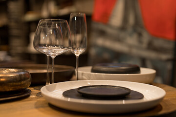 Close up on luxury italian tableware, dishes and glasses.