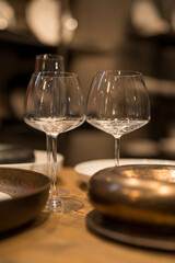 Close up on luxury italian tableware, dishes and glasses.