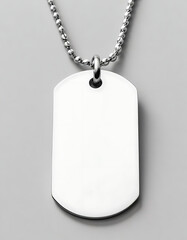Fototapeta premium Personalized engraved dog tag necklace on a white background.