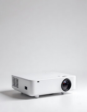 Portable mini projector for movie nights on a white background.