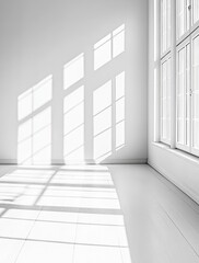 Fototapeta premium Light Streaming Through Large Windows Illuminates a Minimalist Room With Elegant Moldings in Soft Monochrome Tones