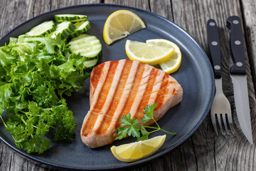 grilled tuna steak on a plate, top view