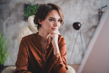 Photo of pretty young girl sit table work computer wear brown silk shirt coworking successful nice light office