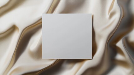 Fototapeta premium Blank canvas resting on soft, flowing fabric invites creativity