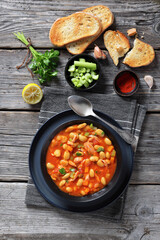 Pasulj, white bean soup with chicken in bowl