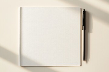 Minimalist workspace featuring blank notebook and pen, perfect f