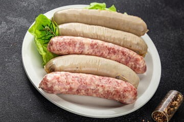 sausages raw meat pork, beef, chicken, lamb fresh tasty food dish gourmet food background on the table rustic food top view copy space