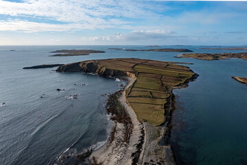 Africa-shaped little island on the Connemara coast, dotted with farming fields, along the Wild Atlantic Way, Ireland