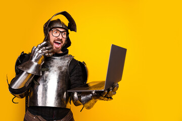 Humorous depiction of a knight using modern technology in front of a vibrant yellow background