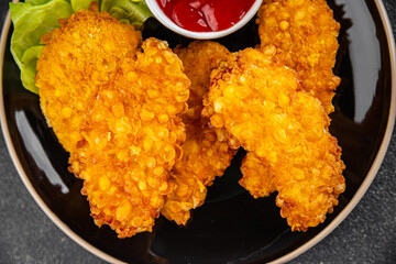 Chicken nuggets deep fried breaded food dish fresh tasty gourmet food background on the table rustic food top view copy space