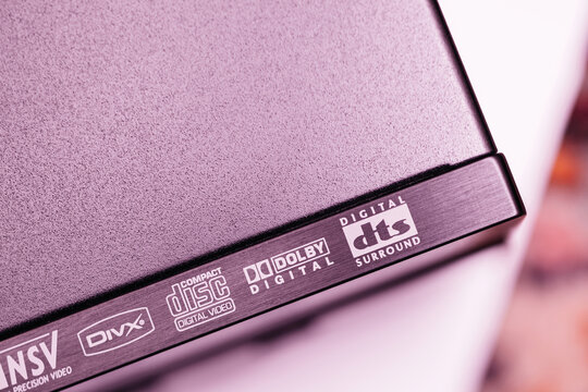 Frankfurt, Germany - Mar 31, 2023: A close-up of a device featuring format logos, including DTS, Dolby Digital, Compact Disc Digital Video, DivX, and NSV, on a brushed metal surface