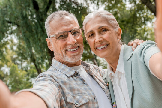 Smile, senior couple and selfie at park, nature or countryside outdoor, bonding together and love. Happy, profile picture and elderly man and woman taking photo for memory, social media or retirement