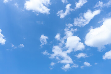Low angle view of beautiful blue sky with strange shape of fluffy white clouds in the morning or evening in sunny day used as natural background texture in decorative art work
