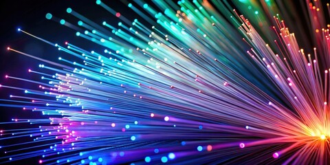 A vibrant display of illuminated fiber optic strands, showcasing a spectrum of colors and radiating outward from a central point, creating a mesmerizing visual effect of dynamic light and technology