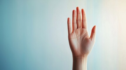 A raised hand against a soft gradient background, symbolizing communication, greeting, or a request for attention.