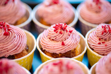 Group of delicious muffins with tasty cream topping