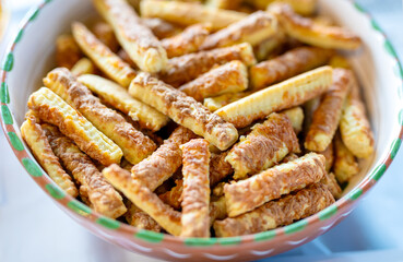 Heap of salted baked cheese biscuits in bowl