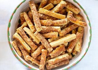 Heap of salted baked cheese biscuits in bowl