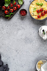 Fusilli pasta with vegetables under a cheesy crispy crust. Mediterranean cuisine.