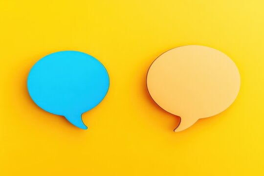 Colorful speech bubbles in contrasting blue and orange colors against a bright yellow background create an eye-catching design element for communication or conversation themes
