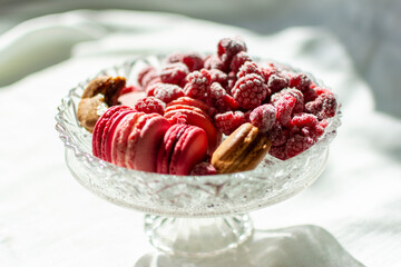 French fruity macaroons in red and pink.