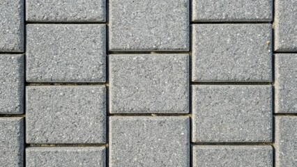 High-resolution Close-Up Texture of Gray Rectangular Paving Stones Arranged in a Patterned Grid Suitable for Backgrounds and Design Projects