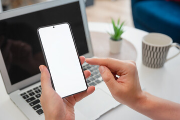 Man holding smart phone with blank screen