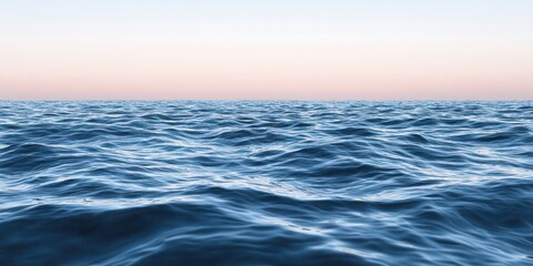 Fototapeta premium A tranquil ocean scene with gentle waves and a pastel horizon