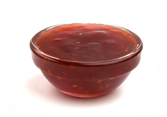 bowl with raspberry jam on white background