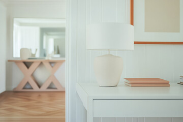 Modern interior design featuring a stylish lamp and furniture in a bright living space