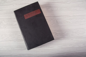  black notebook on light gray background
