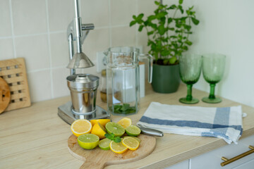 Make fresh homemade lemonade in beige light kitchen.