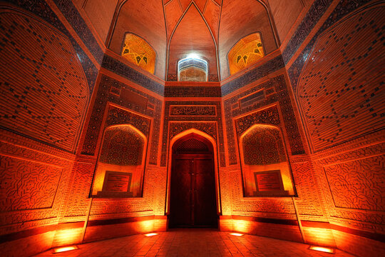 Illuminated interior of the iwan of the Kalan Mosque in the Po-i-Kalyan complex of the historic old town of Bukhara in Uzbekistan, Central Asia