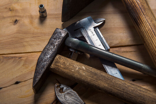 Old carpentry work tools on a brown wooden table background. - Powered by Adobe