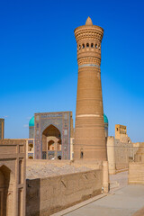 Obraz premium Aerial view of the Po-i-Kalyan complex made of the Kalan Mosque , the Kalyan Minaret and the Mir-i Arab Madrasah in the historic old town of Bukhara in Uzbekistan, Central Asia