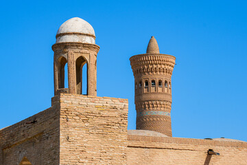 Obraz premium Kalyan Minaret overlooking the Kalan Mosque in the historic old town of Bukhara in Uzbekistan, Central Asia