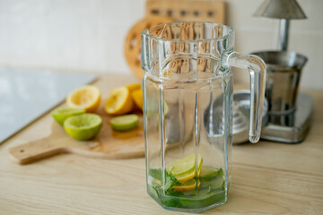 Make fresh homemade lemonade in beige light kitchen.