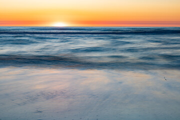 Intentional blurring of the ocean's movement at dawn in the Outer banks