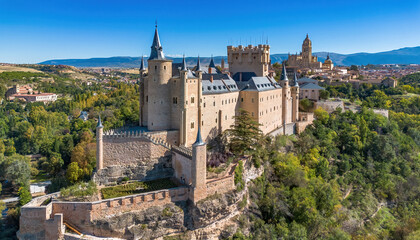 Aerial view of the Alcázar of Segovia, a medieval castle built on a rocky crag in Castile and...