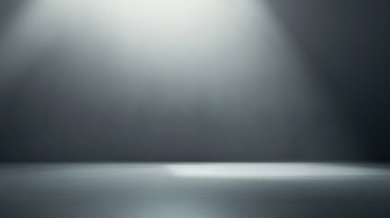 Empty stage with dramatic lighting creating an atmosphere of anticipation.