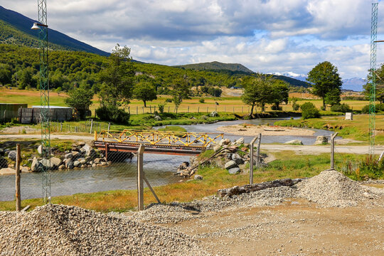 Bridge crossing the Pipo River in front of the Ushuaia Golf Club as seen from the Train of the End of the World station near Ushuaia in the Tierra del Fuego Province of Argentina