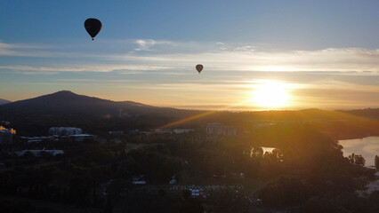 Hot Air Balloons Over Canberra - Aerial Drone Footage of Commonwealth Avenue and Lake Burley Griffin at Sunrise