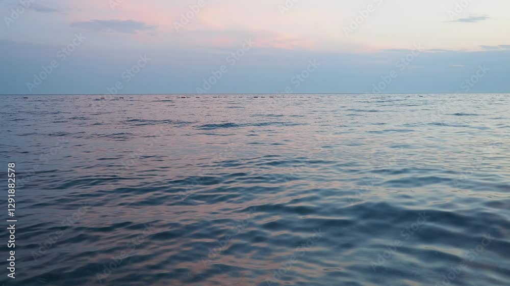 Poster observe tranquil beauty as sun sets on horizon, casting soft hues across ocean. gentle waves ripple 