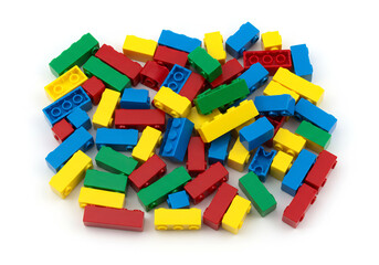 Naklejka premium Colorful plastic blocks scattered playfully.