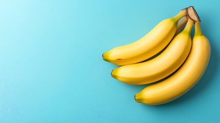 Fresh Bananas on Teal Background