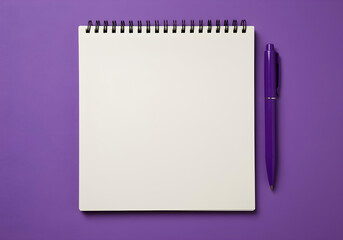 A blank notebook with a purple pen on a purple background.