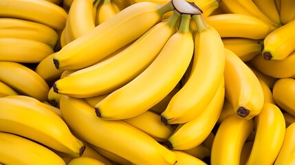 Fresh bananas stacked tightly in a market