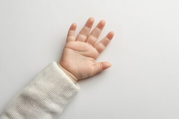 Naklejka premium Close-up of a baby’s open palm isolated on a white background with copy space for design