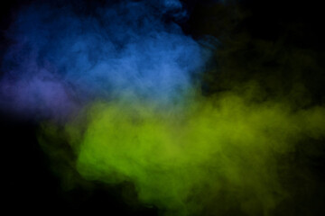 Yellow and green steam on a black background.