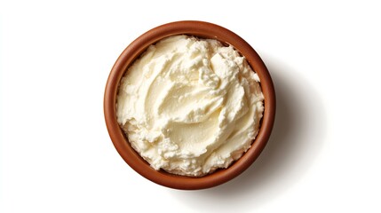 Ricotta cheese in a brown ceramic bowl, rough texture, top view, white background, dairy product 
